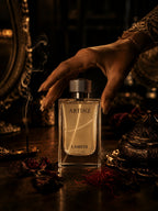 Woman with gold bracelet reaching for Artinz LAMEIS perfume bottle